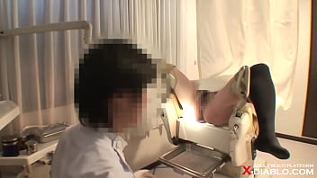 Peeking at the medical examination of a pregnant woman with a large areola and stomach